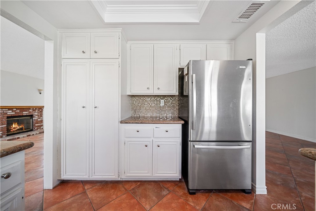 19422 Totem Court Riverside, CA 92508 - Photo 13 of 38 a kitchen with cabinets and stainless steel appliances