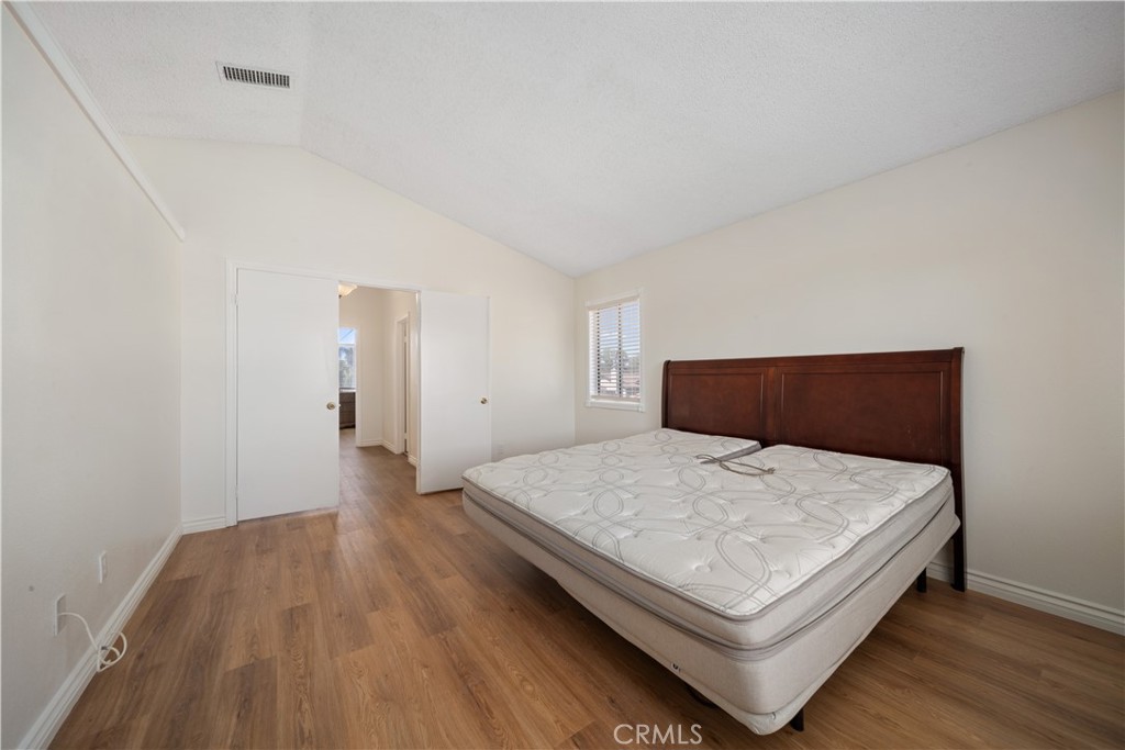 19422 Totem Court Riverside, CA 92508 - Photo 15 of 38 a bedroom with a bed and wooden floor