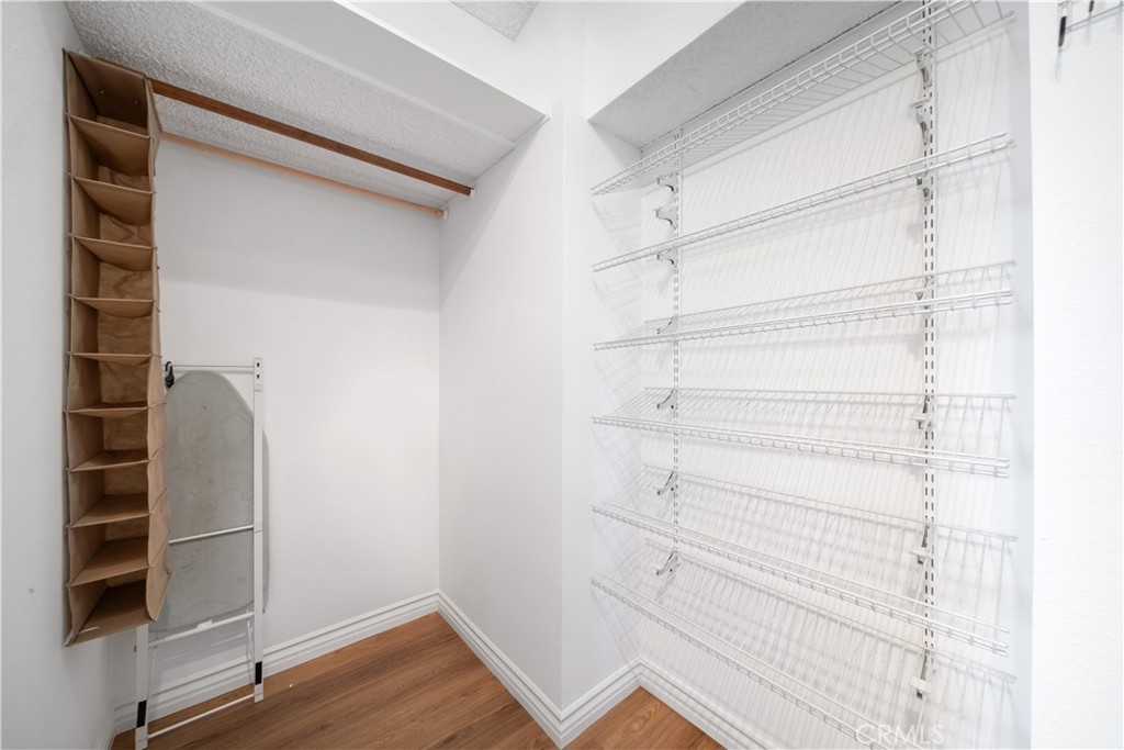 19422 Totem Court Riverside, CA 92508 - Photo 17 of 38 a view of walk in closet with empty racks