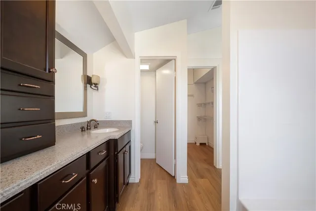 a bathroom with a sink a mirror and a shower