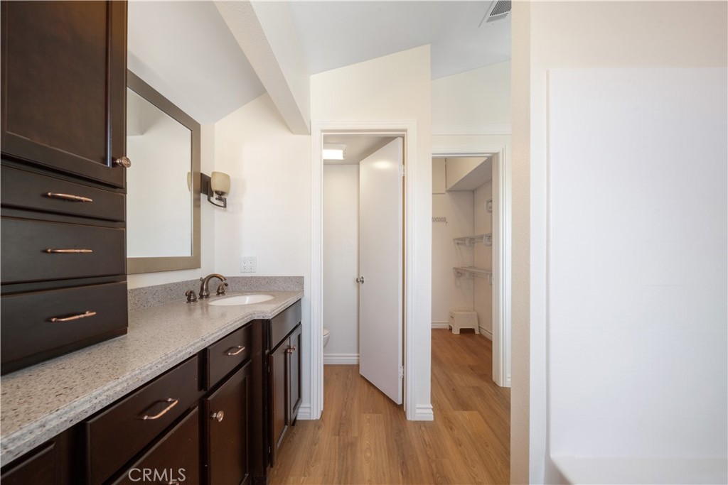 19422 Totem Court Riverside, CA 92508 - Photo 19 of 38 a bathroom with a sink a mirror and a shower