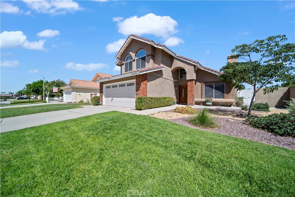 19422 Totem Court Riverside, CA 92508 - Photo 2 of 38 a front view of a house with a yard