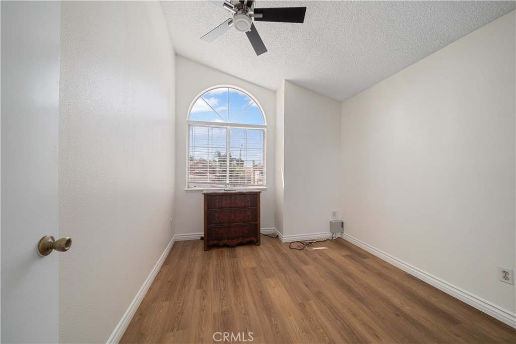 19422 Totem Court Riverside, CA 92508 - Photo 26 of 38 a view of empty room with a window and wooden floor