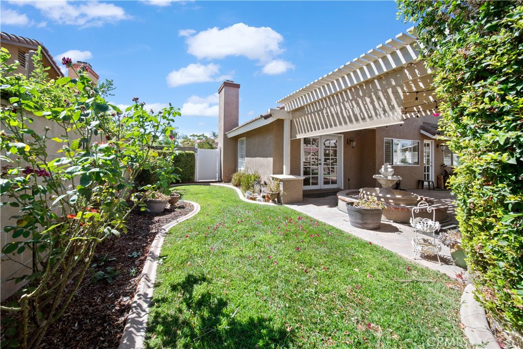 19422 Totem Court Riverside, CA 92508 - Photo 29 of 38 a front view of a house with garden and plants