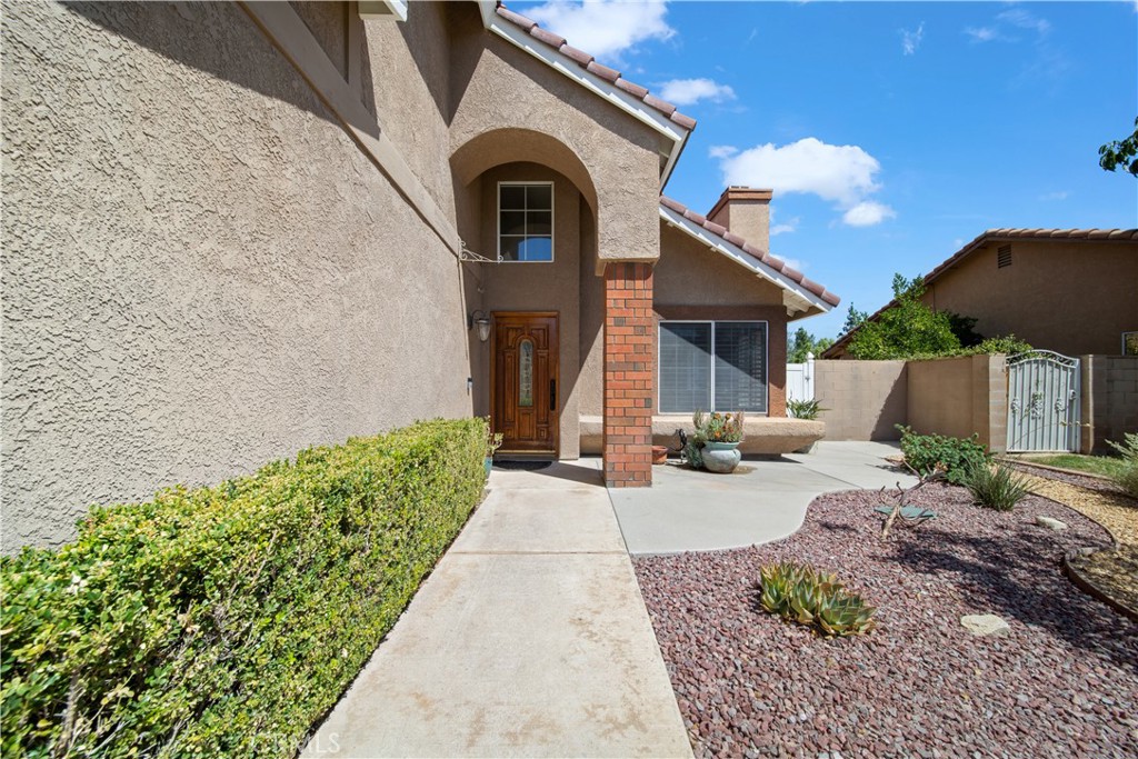 19422 Totem Court Riverside, CA 92508 - Photo 3 of 38 a front view of a house with garden