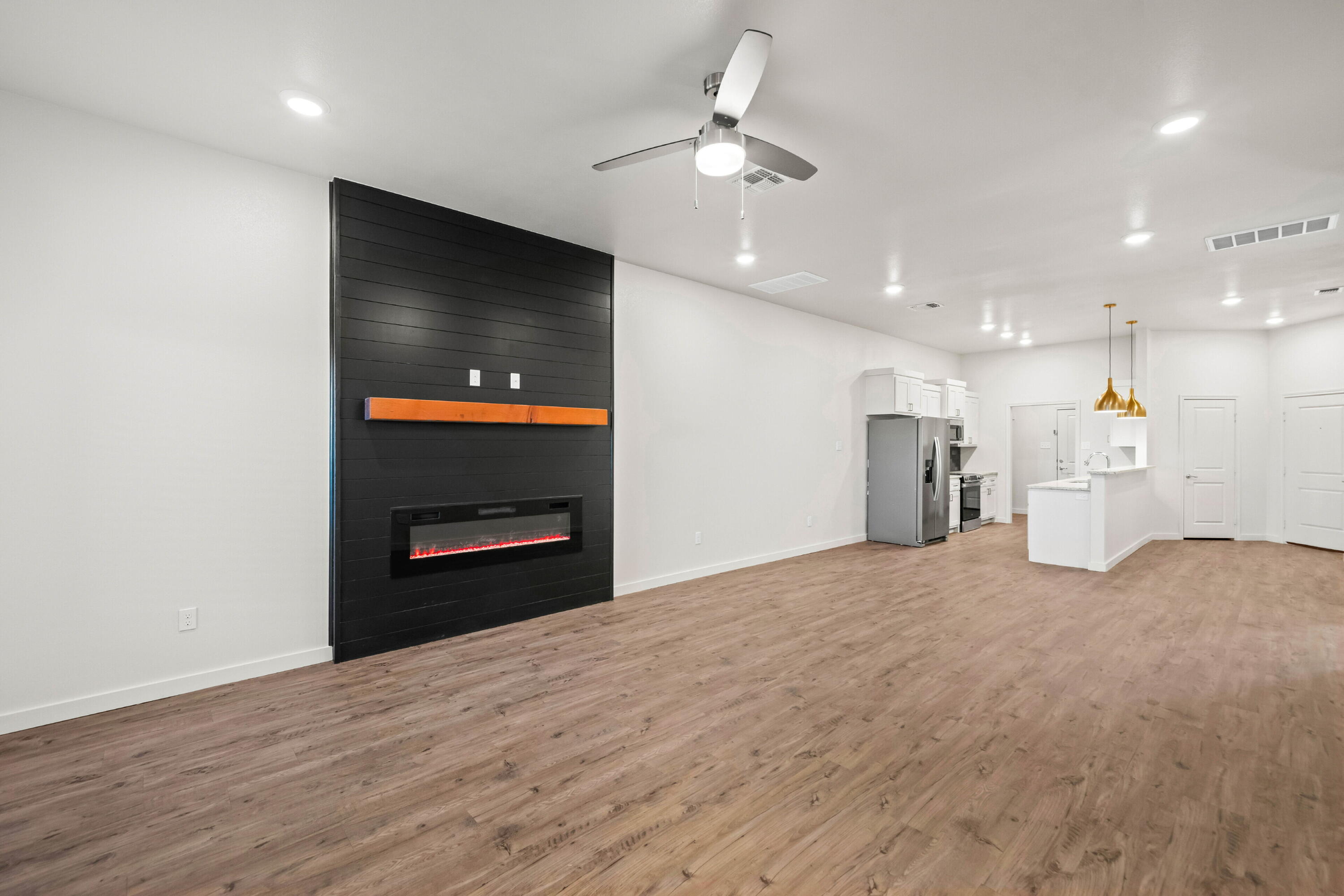 7016 40th Street Lubbock, TX 79407 - Photo 5 of 19 a view of an empty room with a kitchen