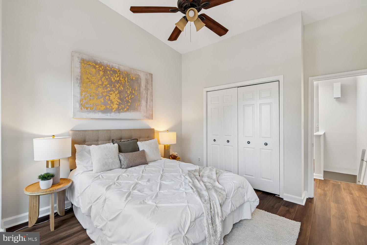 1652 Kramer Street Northeast Washington, DC 20002 - Photo 16 of 26 a bedroom with a bed and wooden floor