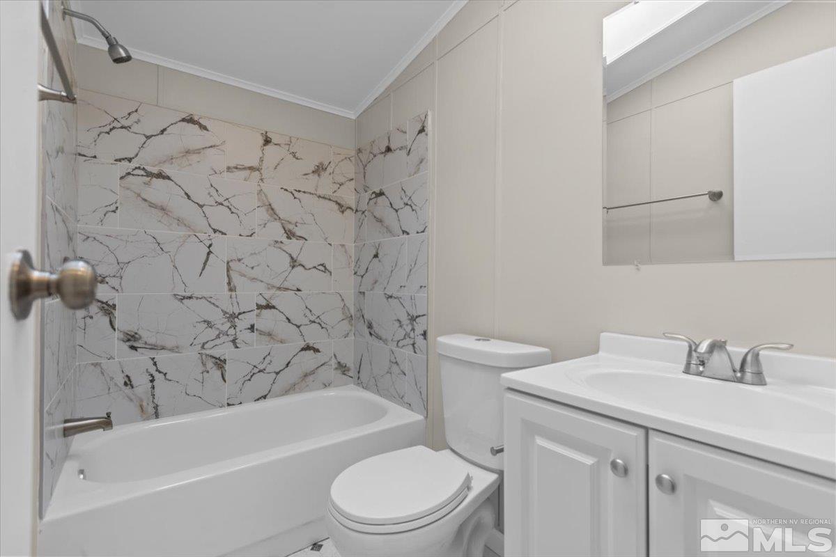 3545 Meadowlark Drive Reno, NV 89508 - Photo 12 of 15 a bathroom with a sink toilet and shower