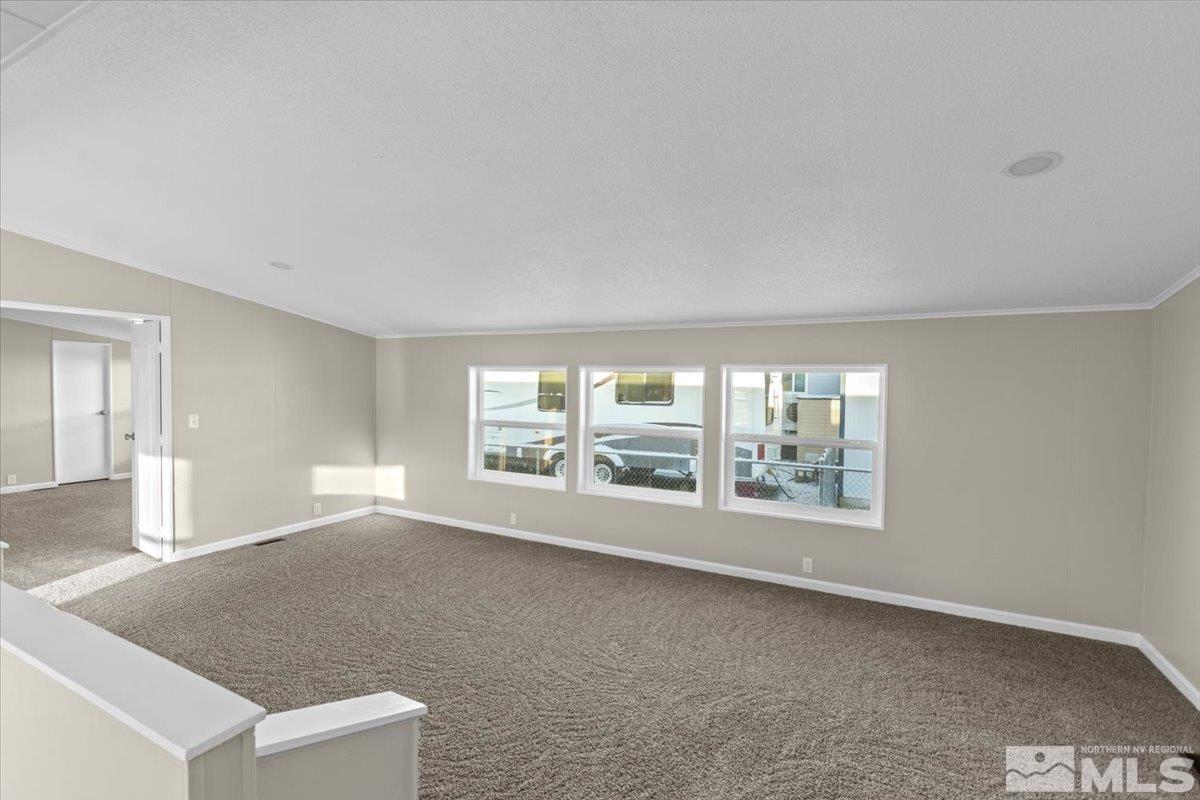 3545 Meadowlark Drive Reno, NV 89508 - Photo 8 of 15 an empty room with windows and view of an empty room