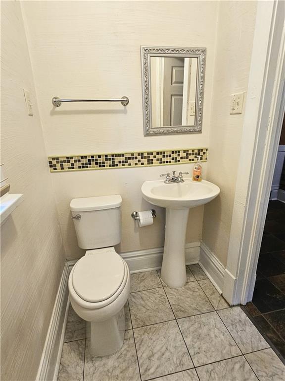 10361 Washington Avenue Irwin, PA 15642 - Photo 21 of 37 a bathroom with a toilet sink and mirror