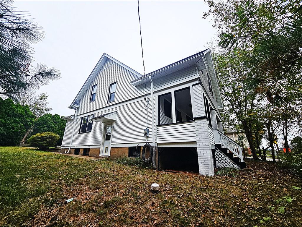 10361 Washington Avenue Irwin, PA 15642 - Photo 36 of 37 a house that has a tree in front of the house