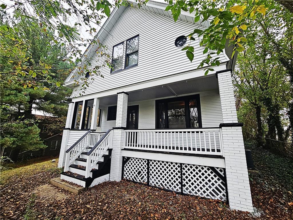 10361 Washington Avenue Irwin, PA 15642 - Photo 4 of 37 a view of a house with a deck