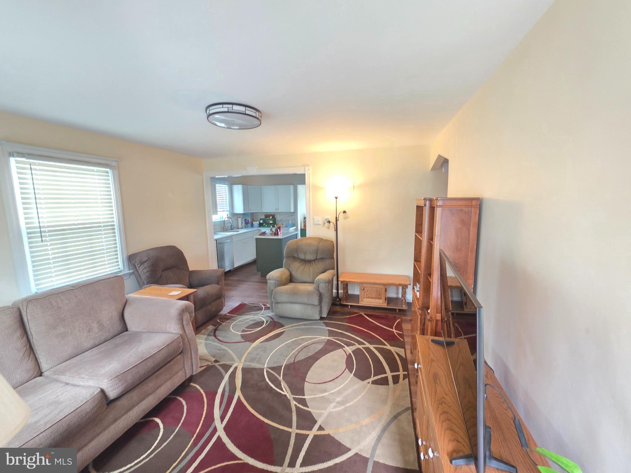 27 George Street Mount Ephraim, NJ 08059 - Photo 6 of 27 a living room with furniture a rug and a window