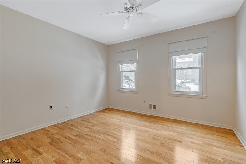 38 Goldfinch Drive Hackettstown, NJ 07840 - Photo 16 of 30 a view of empty room with wooden floor and fan