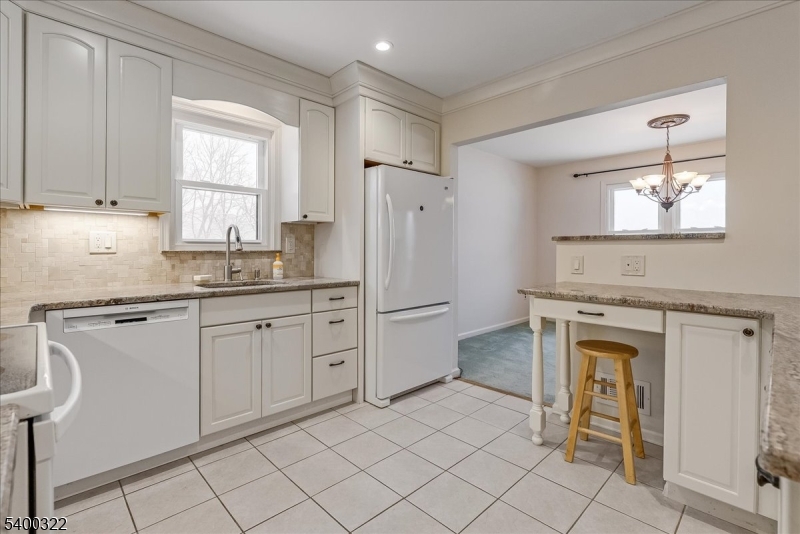 38 Goldfinch Drive Hackettstown, NJ 07840 - Photo 6 of 30 a kitchen with granite countertop cabinets stainless steel appliances a sink and a window