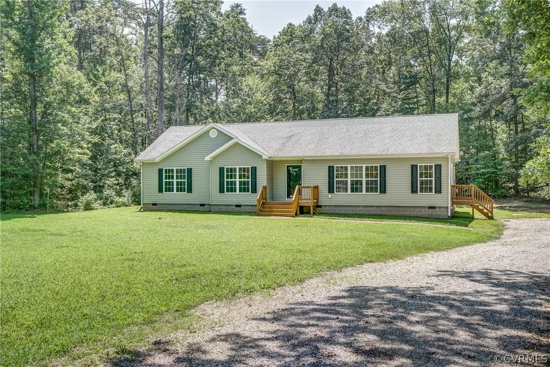3759 Broad St Road Gum Spring, VA 23065 - Photo 1 of 33 a front view of a house with a yard and trees
