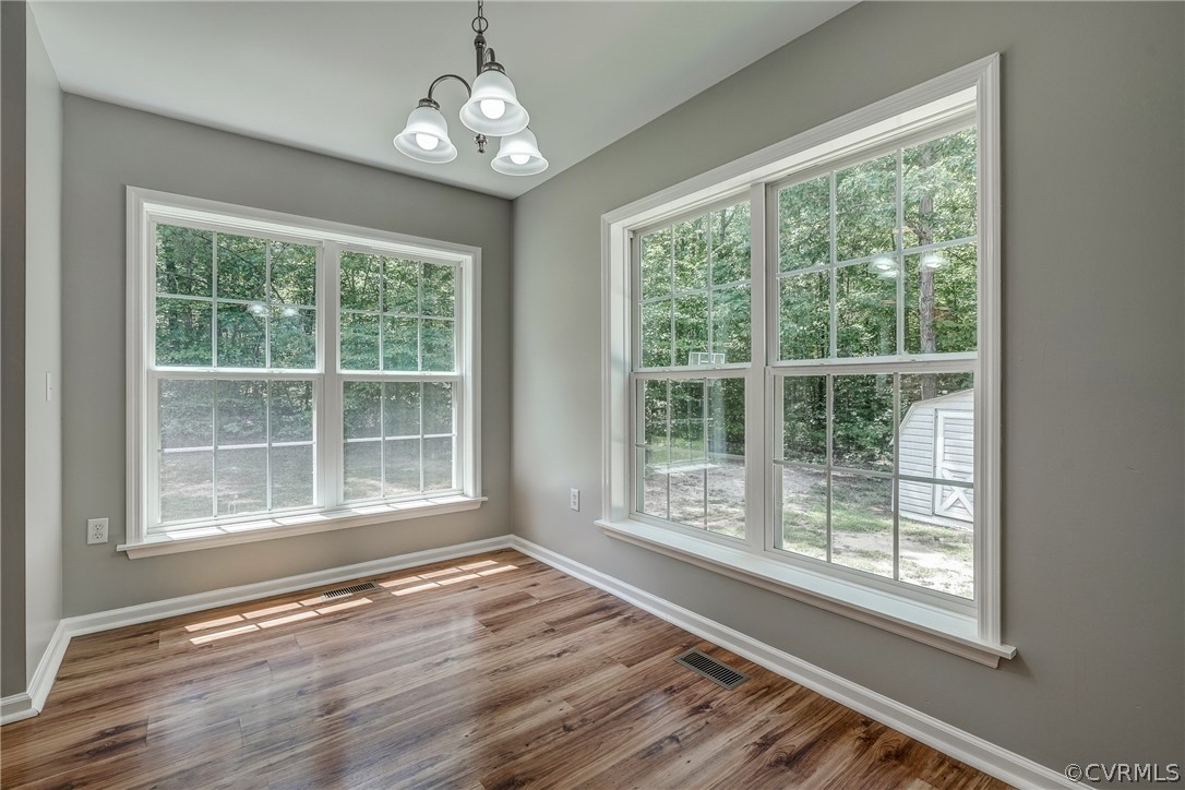3759 Broad St Road Gum Spring, VA 23065 - Photo 24 of 33 a view of an empty room with wooden floor and a window