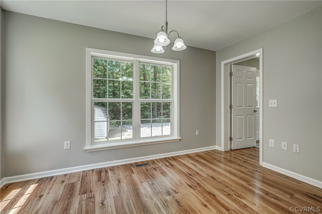 3759 Broad St Road Gum Spring, VA 23065 - Photo 25 of 33 a view of an empty room with wooden floor and a window