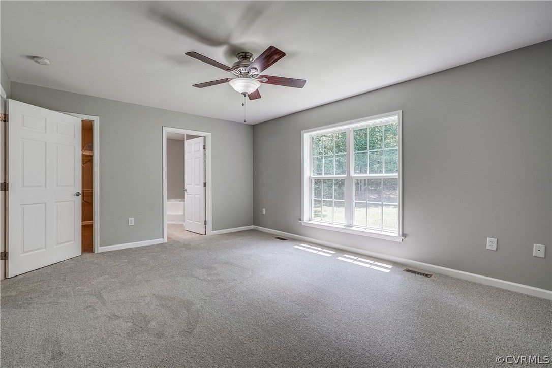 3759 Broad St Road Gum Spring, VA 23065 - Photo 30 of 33 an empty room with chandelier fan and windows
