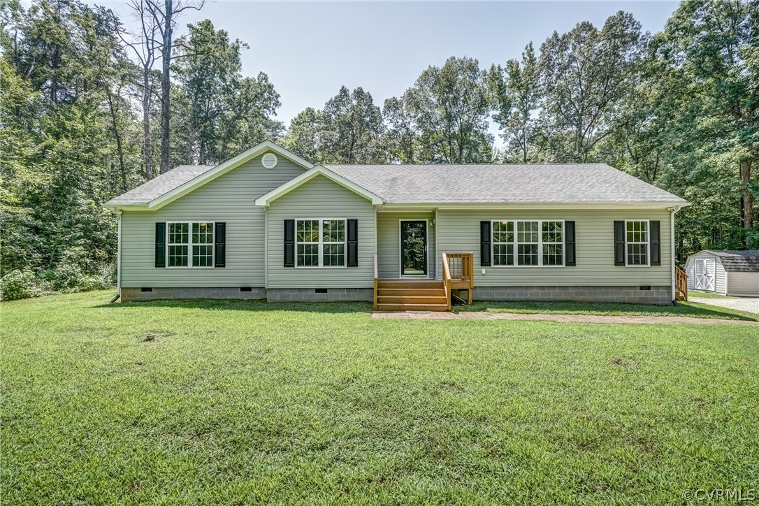 3759 Broad St Road Gum Spring, VA 23065 - Photo 6 of 33 a front view of a house with a garden
