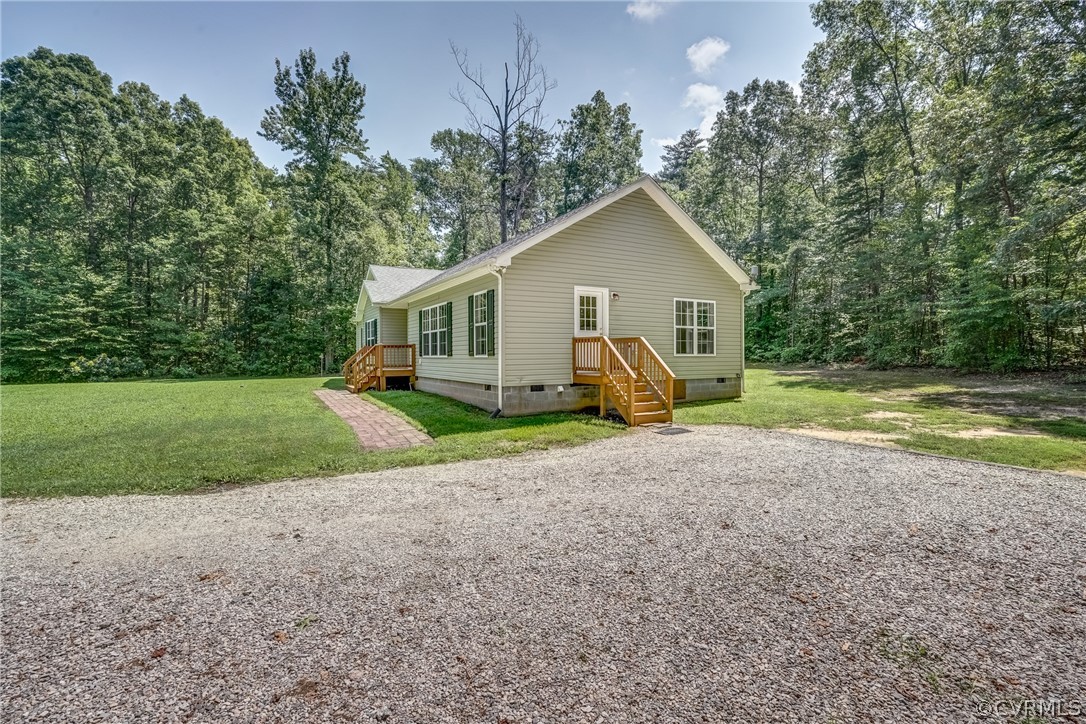 3759 Broad St Road Gum Spring, VA 23065 - Photo 7 of 33 a view of a house with a yard and large trees