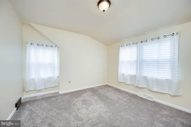 a view of room with window and ceiling fan