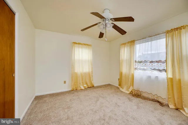 a view of a swimming pool with an outdoor space and seating area