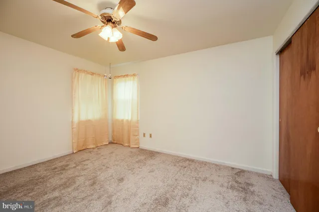 a view of a swimming pool with a yard and a fountain