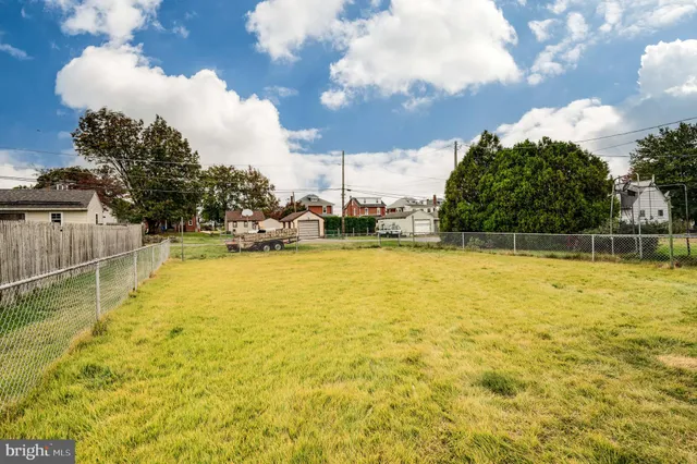 a front view of a house with a swimming pool
