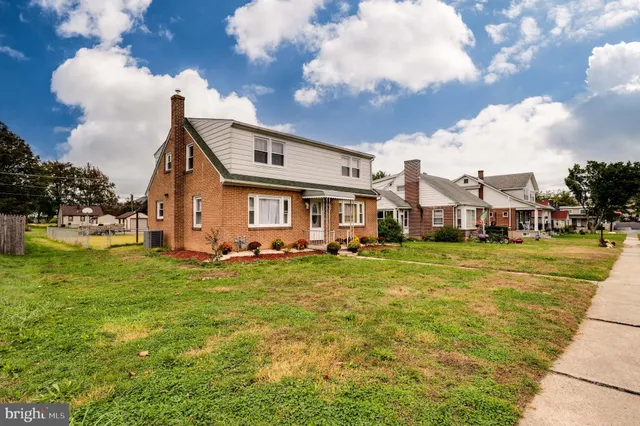 a view of a chandelier fan and livingroom view