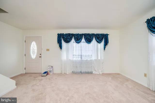 a kitchen with granite countertop a sink stainless steel appliances and cabinets