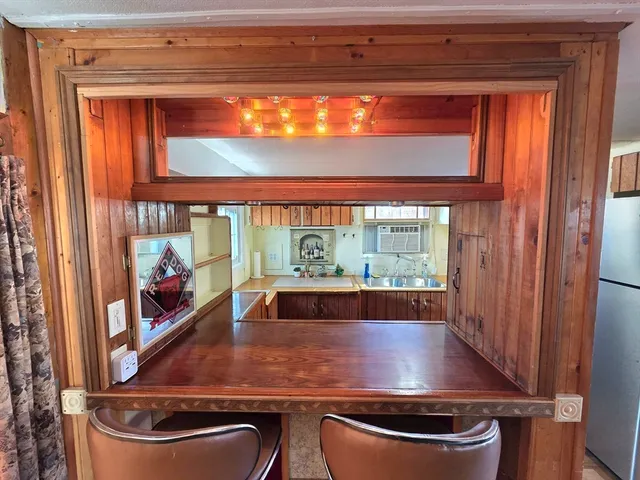a white refrigerator freezer sitting inside of a kitchen