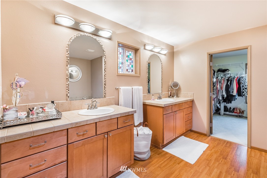 20426 Corbridge Road Southeast Monroe, WA 98272 - Photo 13 of 23 a bathroom with a sink vanity and a mirror