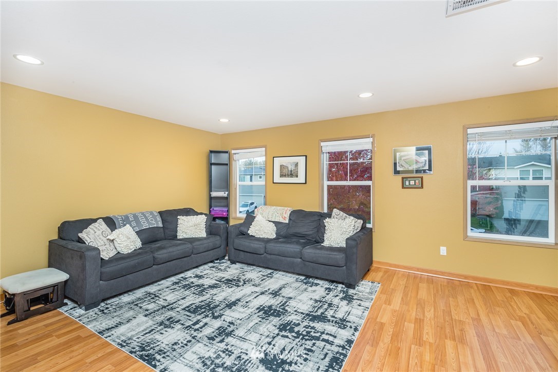 20426 Corbridge Road Southeast Monroe, WA 98272 - Photo 15 of 23 a living room with furniture and a couch