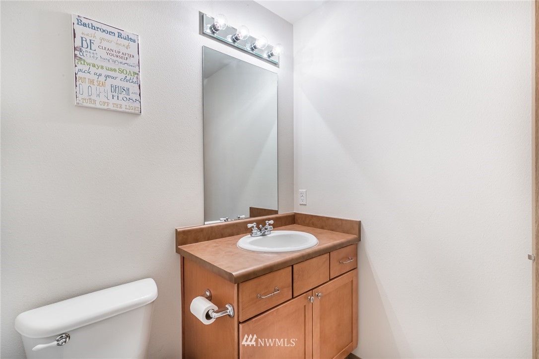 20426 Corbridge Road Southeast Monroe, WA 98272 - Photo 19 of 23 a bathroom with a sink a toilet and mirror