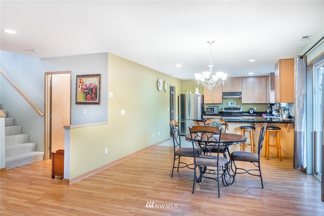20426 Corbridge Road Southeast Monroe, WA 98272 - Photo 8 of 23 a view of a dining room with furniture and wooden floor