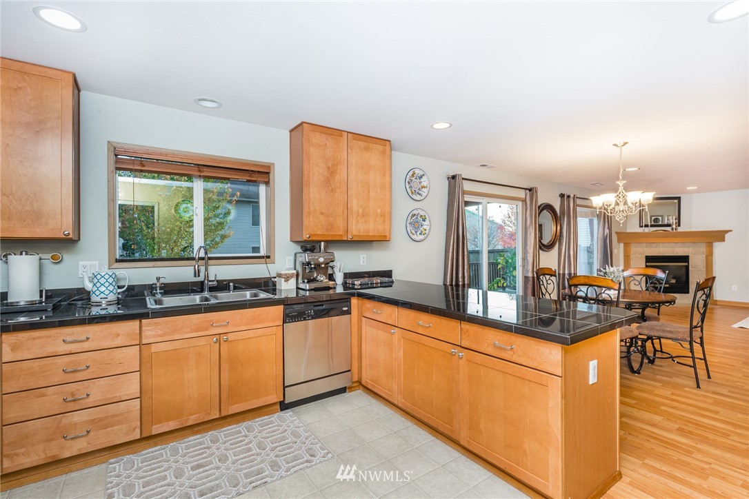 20426 Corbridge Road Southeast Monroe, WA 98272 - Photo 10 of 23 a kitchen with granite countertop a sink and counter space
