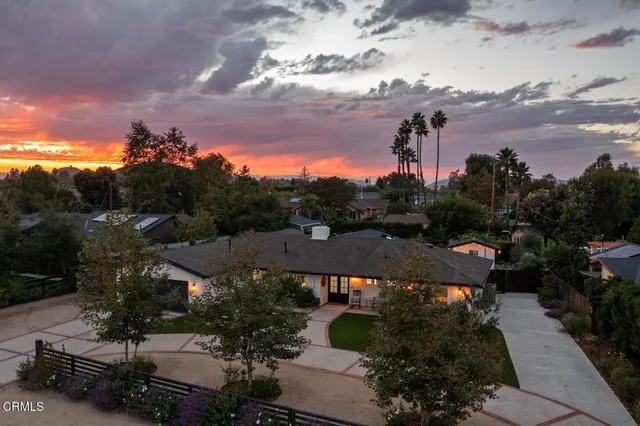 a view of a city street both side of house
