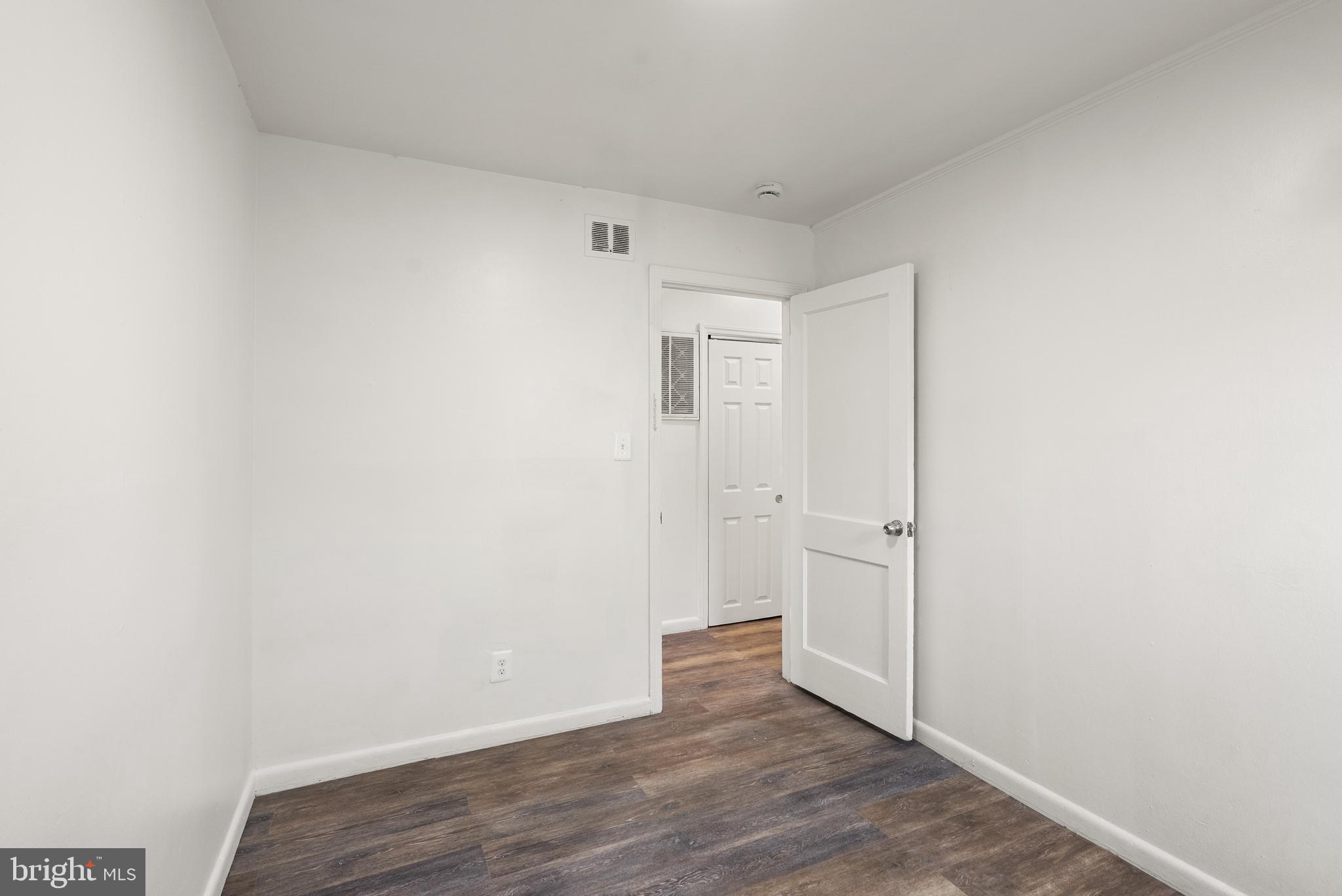 28 East Reed Avenue Alexandria, VA 22305 - Photo 23 of 33 a view of an empty room with wooden floor