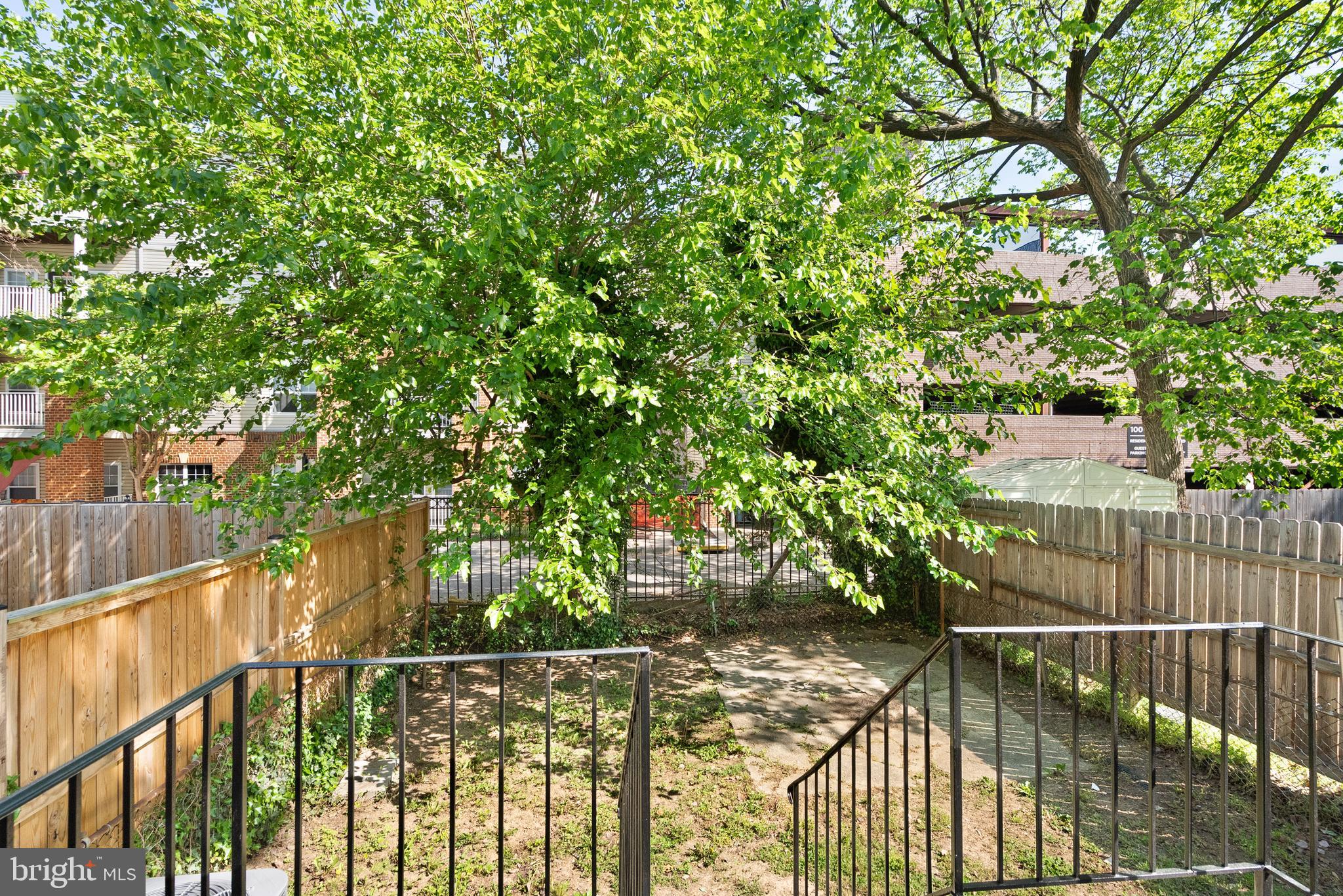 28 East Reed Avenue Alexandria, VA 22305 - Photo 26 of 33 a view of yard with green space and wooden fence
