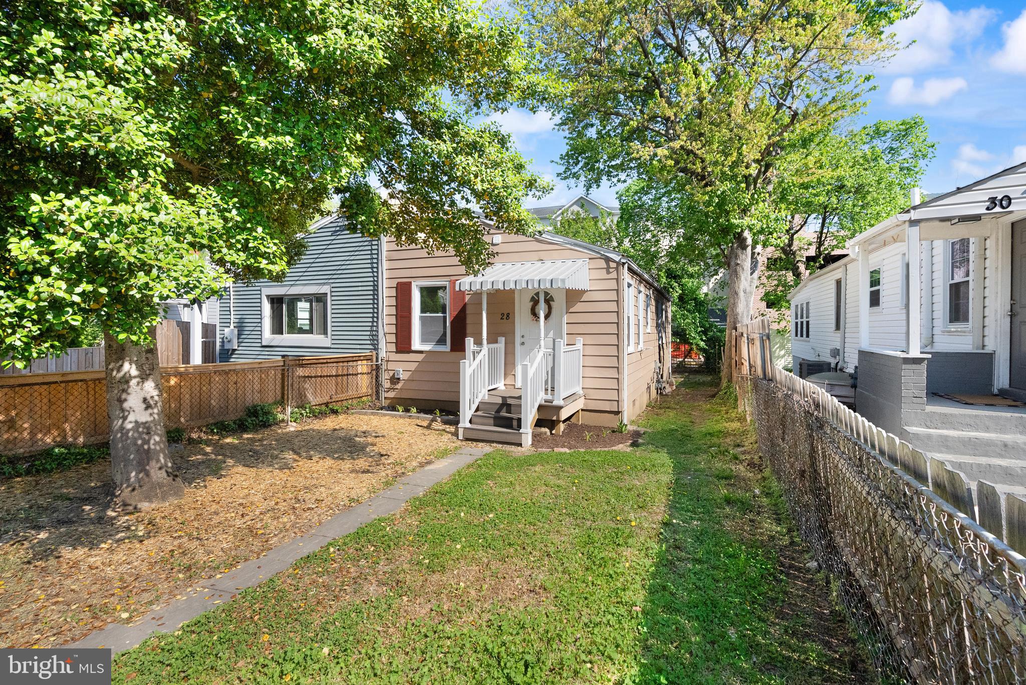 28 East Reed Avenue Alexandria, VA 22305 - Photo 3 of 33 a view of a house with backyard and sitting area