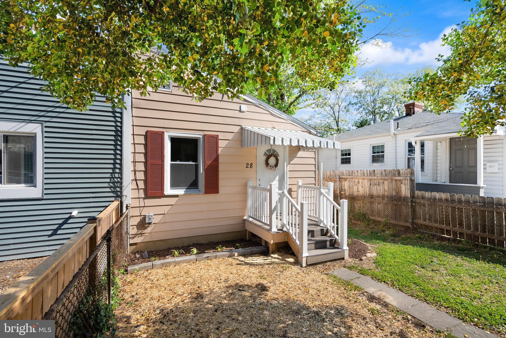 28 East Reed Avenue Alexandria, VA 22305 - Photo 5 of 33 a view of a house with a yard and wooden fence