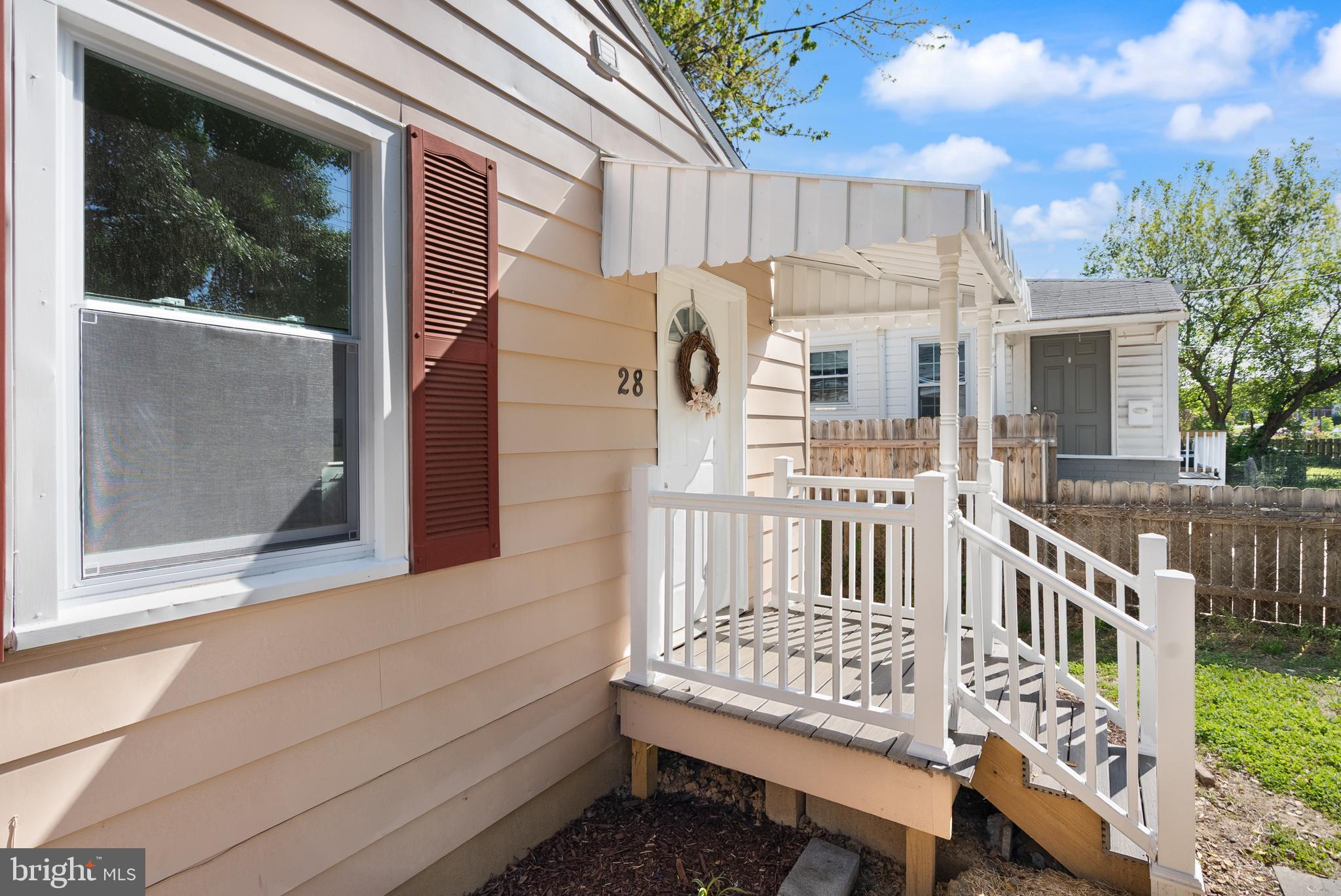 28 East Reed Avenue Alexandria, VA 22305 - Photo 7 of 33 a view of a porch with a bench