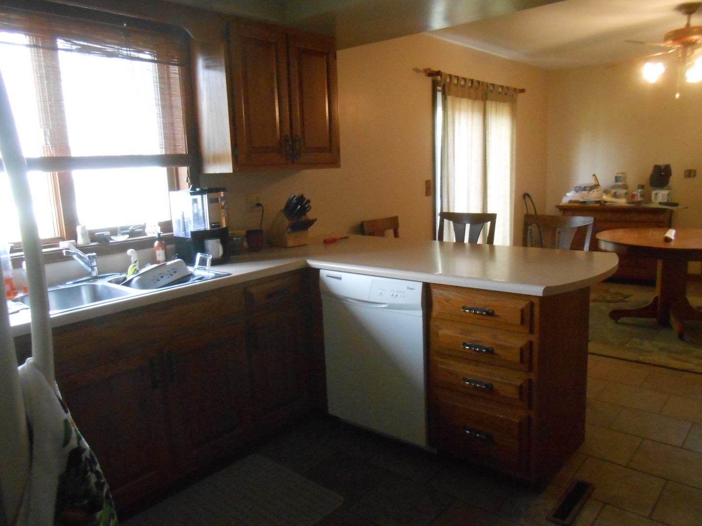 2916 East 29th Road Seneca, IL 61360 - Photo 6 of 14 a kitchen with a sink a window and cabinets