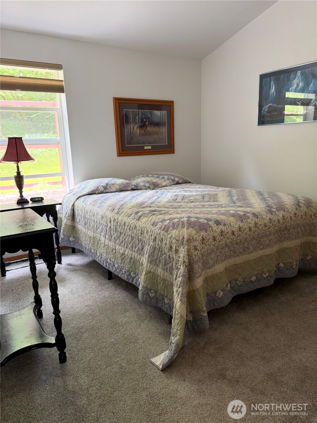 1171 Ray Hicks Street Raymond, WA 98577 - Photo 17 of 33 a bedroom with a bed chair and painting on the wall