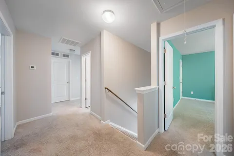a bedroom with a bed and a tv