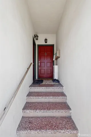 a kitchen with a stove a sink a microwave and wooden cabinets
