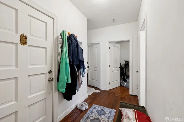 a bedroom with a bed and a mirror