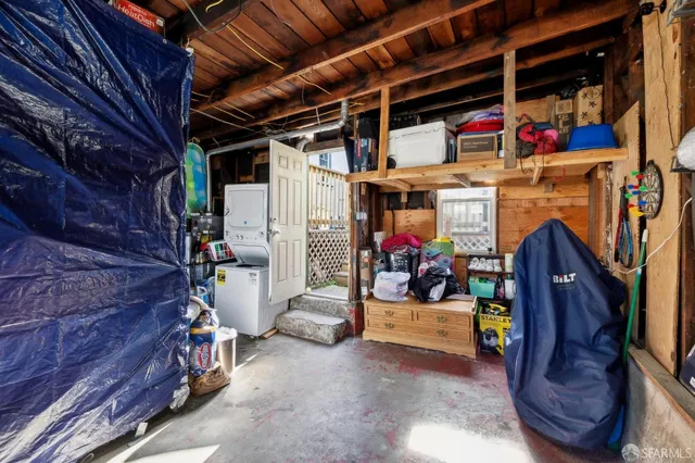 a view of a chairs and table in the balcony