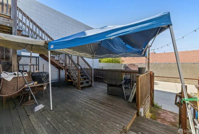 a view of a patio with wooden floor